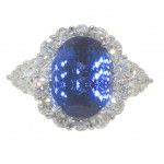 9.12 CT. TW Oval Cut Tansanite In Diamond Halo Accented 14 KT Ring
