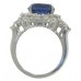 9.12 CT. TW Oval Cut Tansanite In Diamond Halo Accented 14 KT Ring